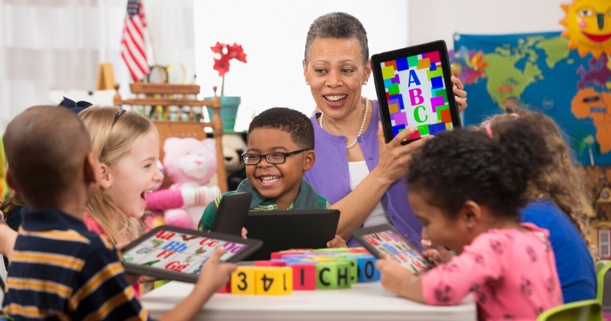 Teacher in elementary classroom with students